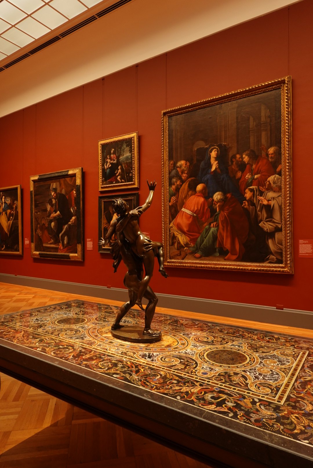 Bronze sculpture and Renaissance paintings inside the Metropolitan Museum of Art